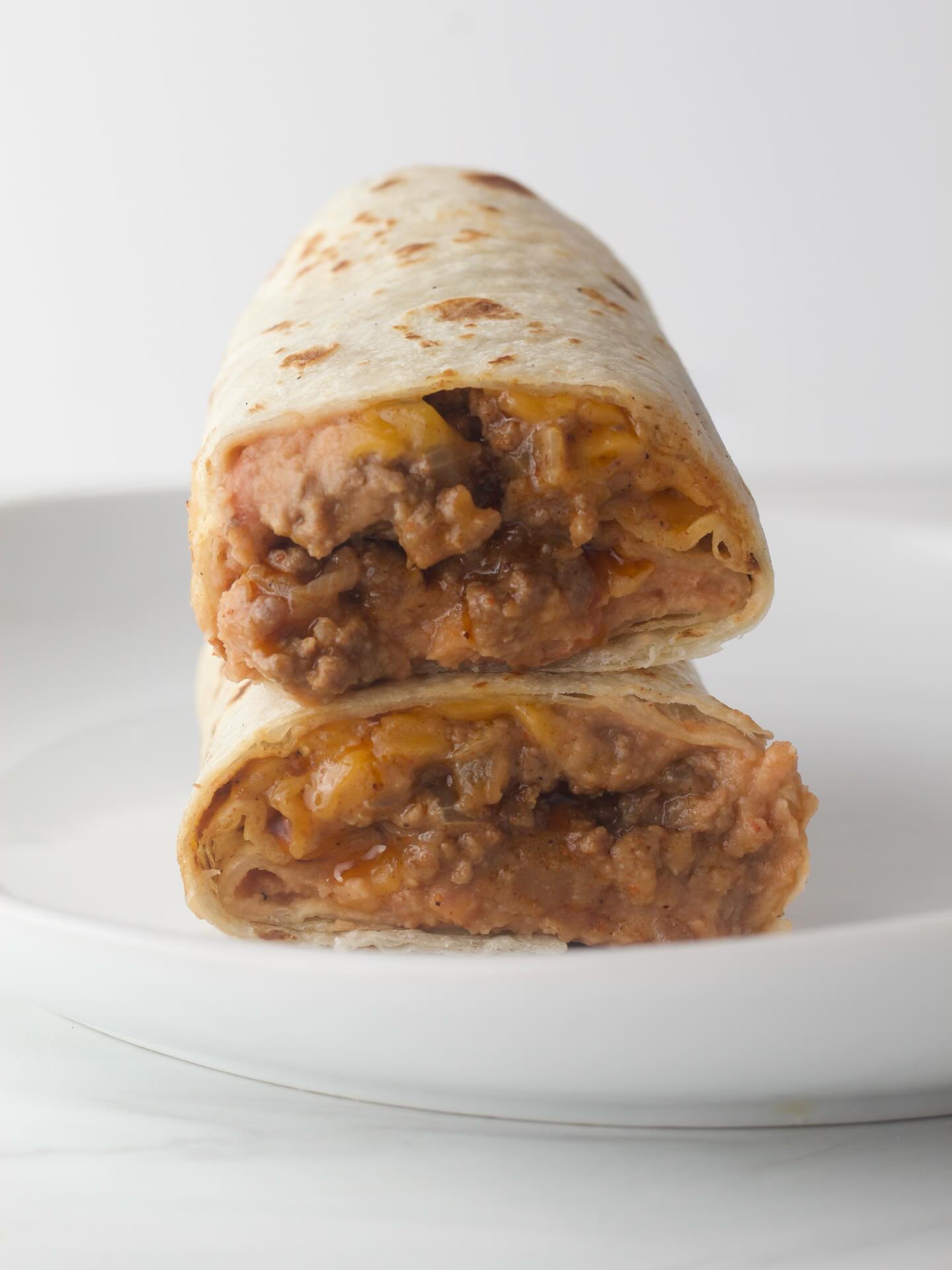 This is one of my recent favorites: a Simple Beef and Bean Burrito that is not boring. Definitely worth trying you can get the full recipe on the blog Semiscatched.com 

#refriedbeans#groundbeef#cheese#tortillas#tacoseasoning